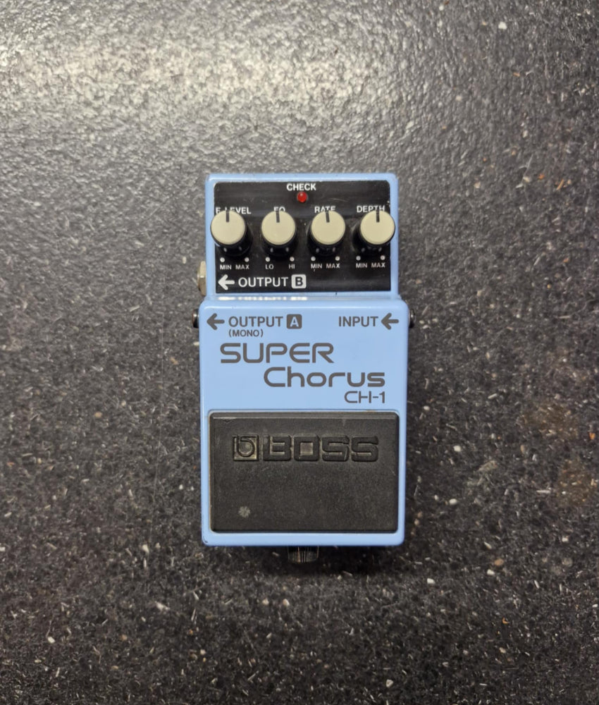 Boss Super Chorus CH-1 guitar effects pedal on a textured surface