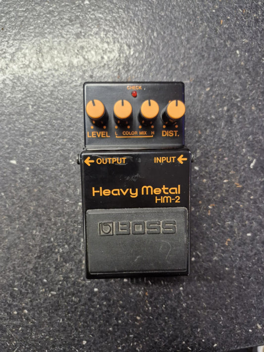 Boss Heavy Metal HM-2 guitar effects pedal on a textured surface